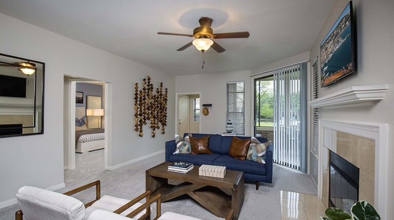 Living Room with Ceiling Fan and Fireplace